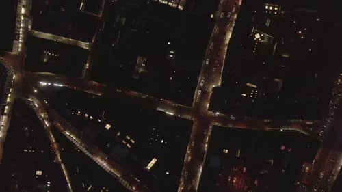 AERIAL: Slow Overhead Shot of City at Night with Lights and Traffic, Cologne, Germany