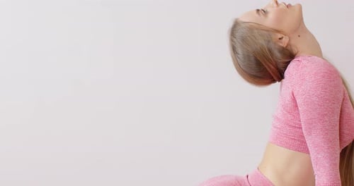 Blonde Woman Stretching on Yoga Mat
