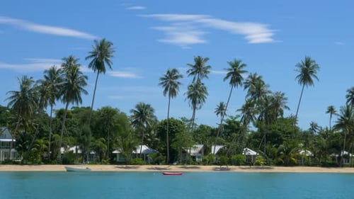 Tropical island resort with white sandy beach.