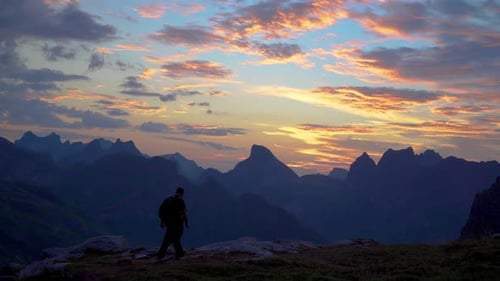 Hikers on Mountain Ridge at Sunrise