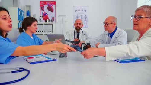 Group of Medical Staff Discussing in Hospital Meeting Room