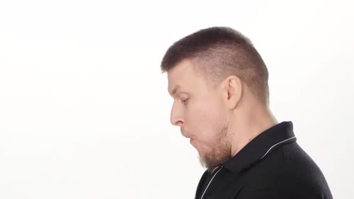 Man Enthusiastically Eating a Hamburger Close Up