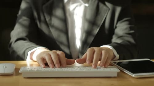 Suit Man Working With Tablet