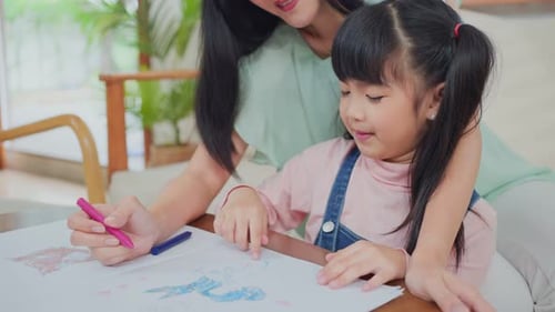 Mother and Child Drawing Together at Home