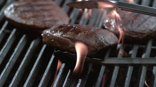 Steak on grill in slow motion, shot on Phantom Flex 4K