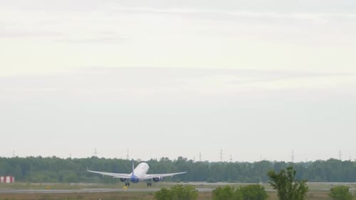 Commercial Airplane Taking off from Airport Runway