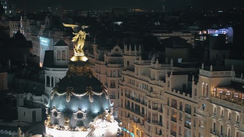 Madrid at night Cityscape with the dome of Metropolis Building, Spain