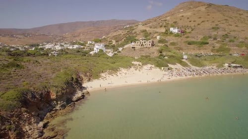 Aerial view of people enjoying a public beach in Greece.