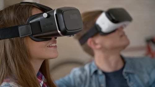 Young Couple Experiencing Virtual Reality Headsets