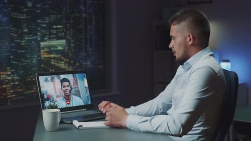 Young Man on Video Call in Urban Office