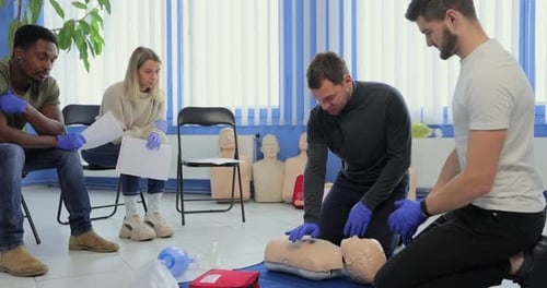 Adults Learn CPR in Medical Training Session