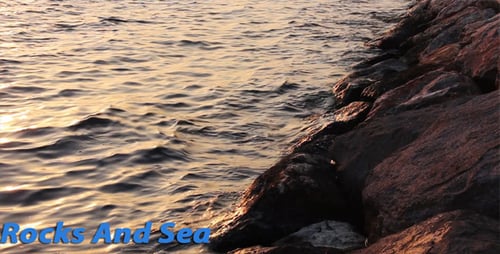 Gentle Waves at Sunset on a Rocky Shoreline