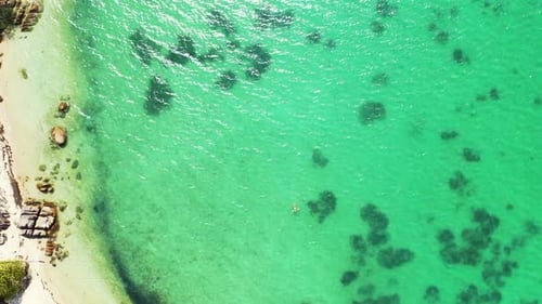 Aerial drone view travel of tropical island beach lifestyle by blue lagoon with white sand backgroun