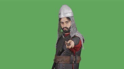 Medieval Warrior Points Dagger on Green Screen