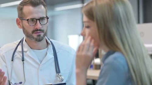 Doctor Consulting Patient in Clinic