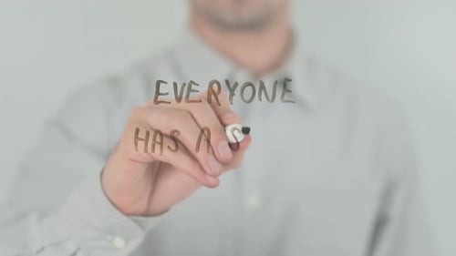 Writing "Everyone Has a Story" on Glass