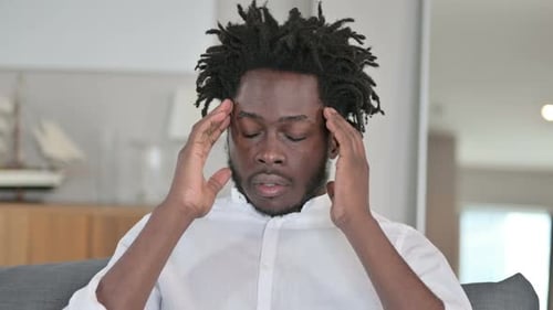 Young Adult Massaging Temples Due To Headache