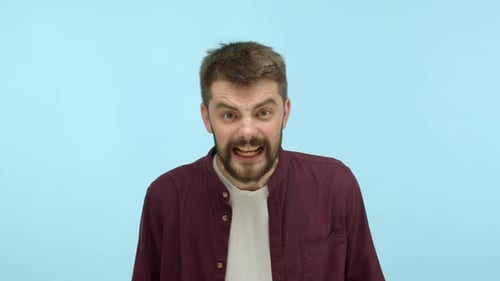 Man Expressing Wide Variety of Emotions in Studio