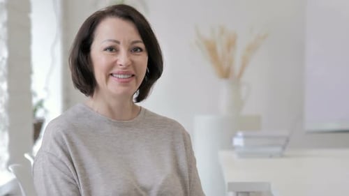Woman Smiling in a Bright Indoor Setting