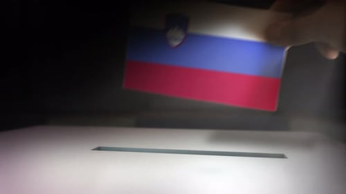 Hand Submits National Flag Ballot into Official Voting Box