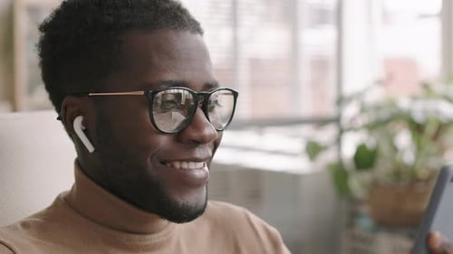 Smiling Man Using Smartphone for Video Call