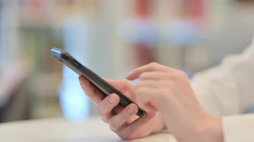 Close Up Female Hands Typing on Smartphone