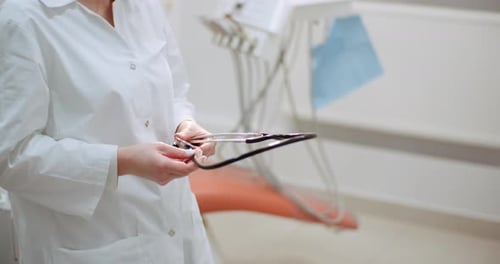 Doctor With Stethoscope Posing in Medical Office