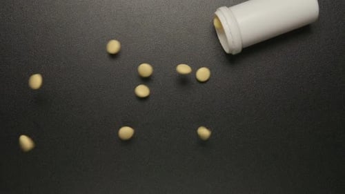 Plastic tube falls and pills fall out of him