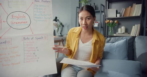 Enthusiastic Woman Teaches English Grammar From Home