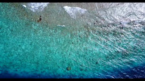 Aerial drone shot sky of idyllic lagoon beach journey by clear ocean with white sand background of j