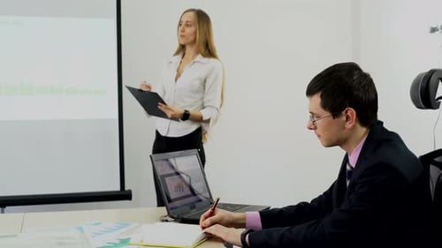 Woman Giving Business Presentation to Colleague