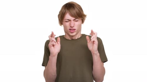 Young Adult with Fingers Crossed for Luck