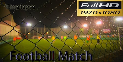 People Play Soccer Game at Night in City