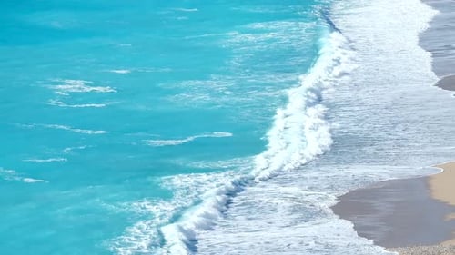 Waves On The Beach Sand