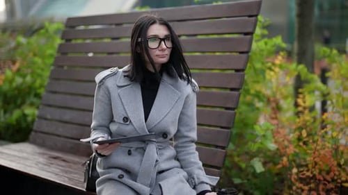 Woman is Working Distantly with Tablet in Park in Morning Successful Business Lady