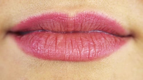 Close Up of Woman's Pink Lipstick