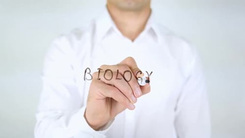Man Writing Biology on Clear Surface