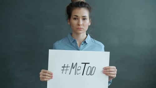 Portrait of Young Asian Woman Holding Banner with MeToo Hashtag Fighting Against Harassment
