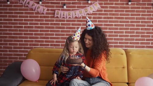 Mother and Daughter Celebrate a Birthday Together