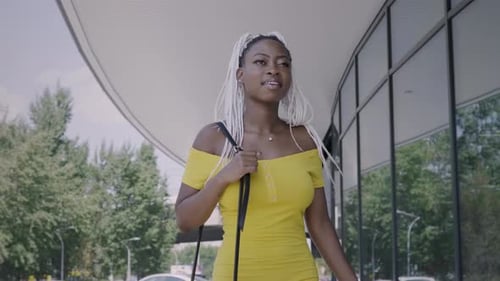 Stylish Black Woman Walking Down The Street