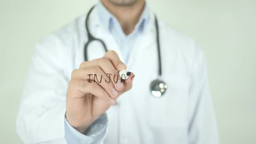 Doctor Writes Injury on Clear Surface