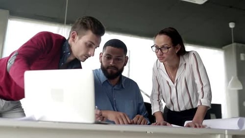 Colleagues Collaborating in Office Environment