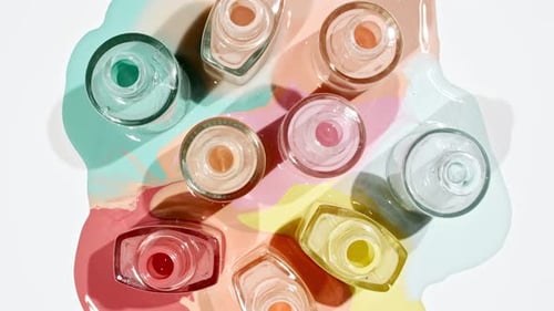 Colorful Nail Polish Bottles Displayed on White Background