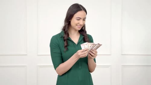 Indian woman counting money
