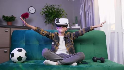 Teen Boy Using VR Headset on Couch