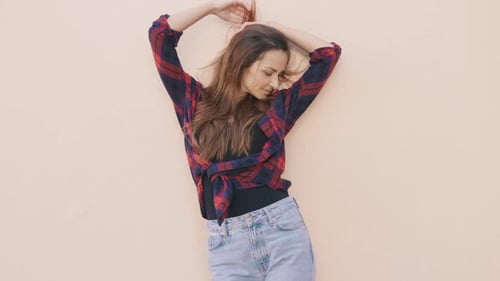Beautiful Woman Posing in Flannel and Jeans