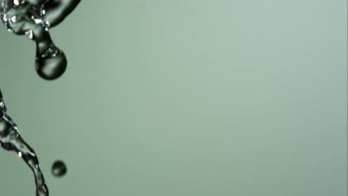 Water pouring and splashing in ultra slow motion 1500fps on a reflective surface - WATER POURS