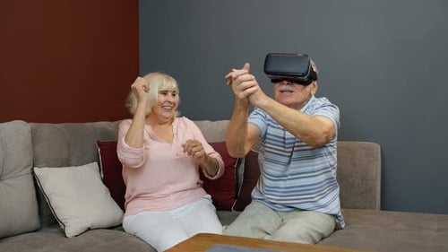 Senior Couple Exploring Virtual Reality Technology at Home