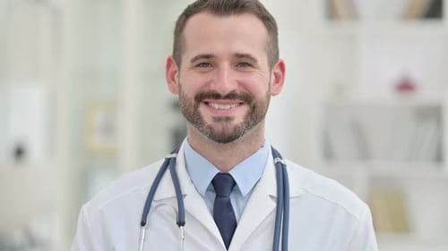 Friendly Doctor Smiling in Bright Hospital Setting