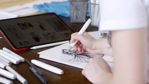 Fashion Design Artist Drawing Garment on Desk